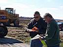17.jpg: Foreman Mike Stiffarm, at left, reviews paperwork
